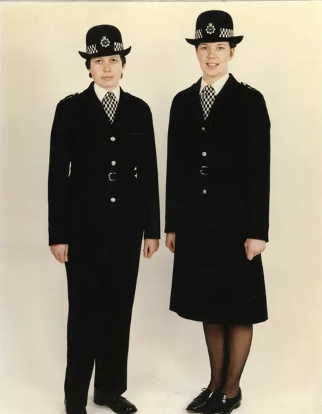 Two women police officers in new bowler hat, London