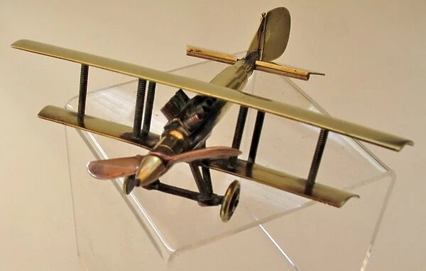 WWI biplane bullet fuselage with copper propeller