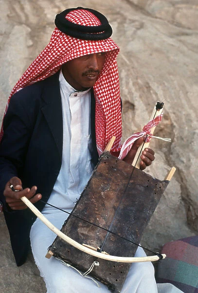 A young Jordanian man plays a rababah