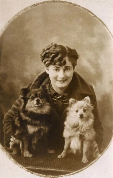 Young woman with little Pomeranians