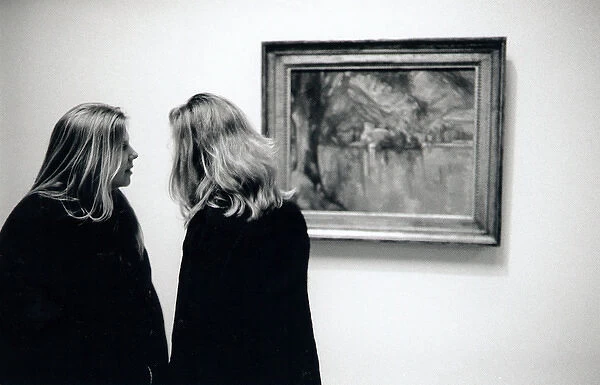 Two young women in an art gallery, London