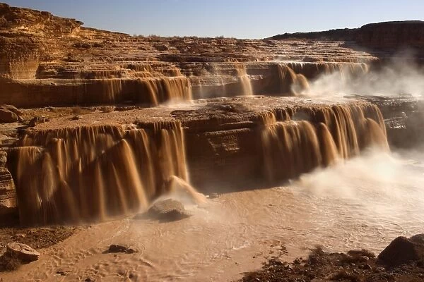 Grand Falls - raging muddy falls of the Little Colorado River during snowmelt. This spectacle occurs only a few days during the year, either during spring snowmelt or after a period of intense monsoon rainstorms