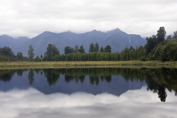 New Zealand - Reflections of southern alps in Lake Matheson - South Westland - South Island