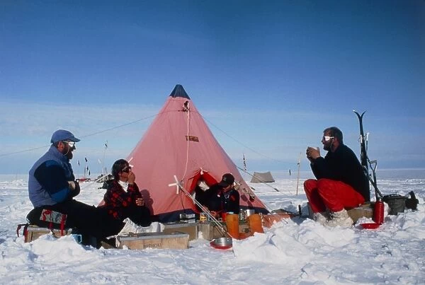 Antarctic research team relaxing outside tent