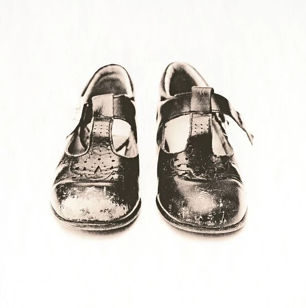 Childs worn shoes