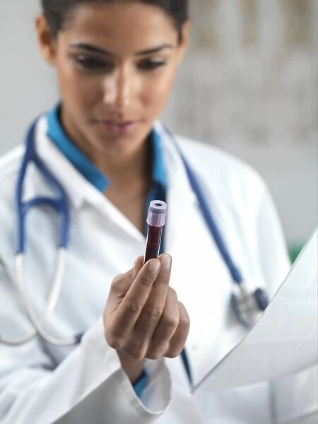 Doctor holding a blood sample C013  /  8841