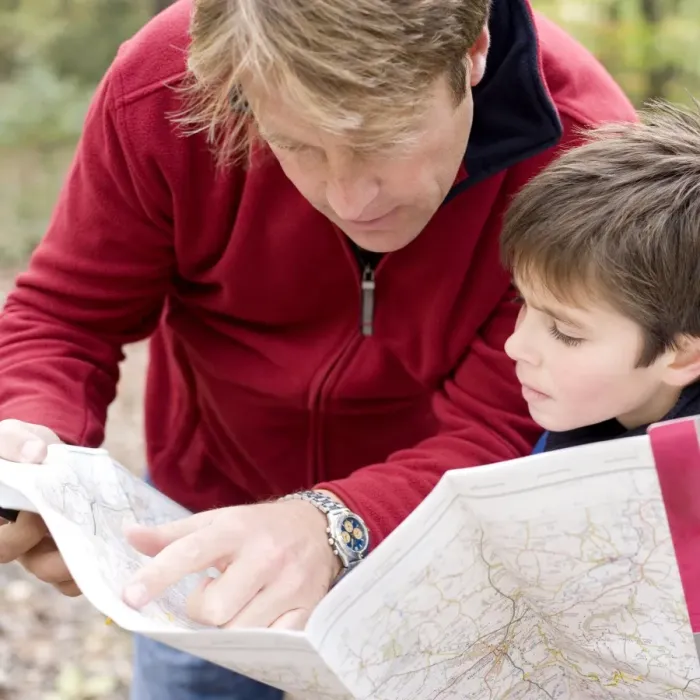 Framed Print : Father and son reading a map Print Framed Print : Father and son reading a map Print