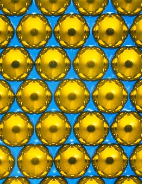 Macrophotograph of ball bearings suspended in oil