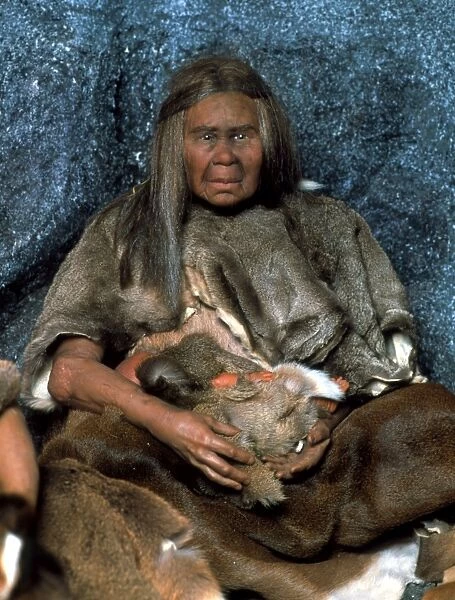 Model of a neanderthal woman holding a baby
