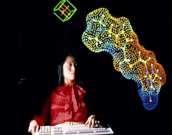 Scientist w  /  computer 3D image of complex molecule