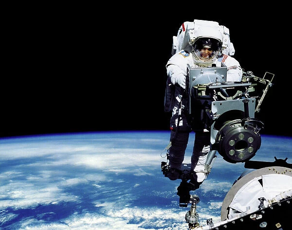 Space walk. Composite computer artwork of an astronaut working on the outside