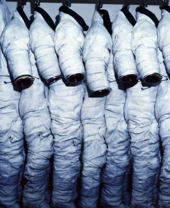 Framed Print : Space Suits Print: Row of EMUs Hanging from Hooks Framed Print : Space Suits Print: Row of EMUs Hanging from Hooks