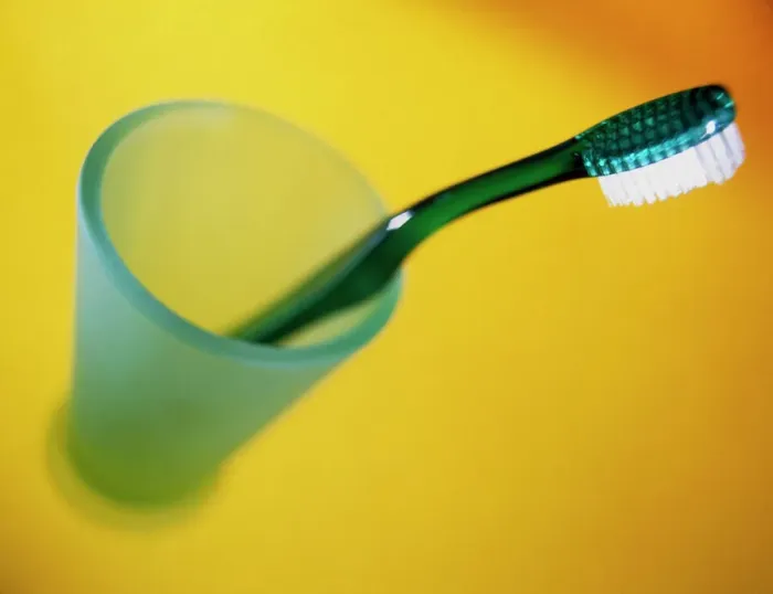 Framed Print : A Green Toothbrush in a Pot Print