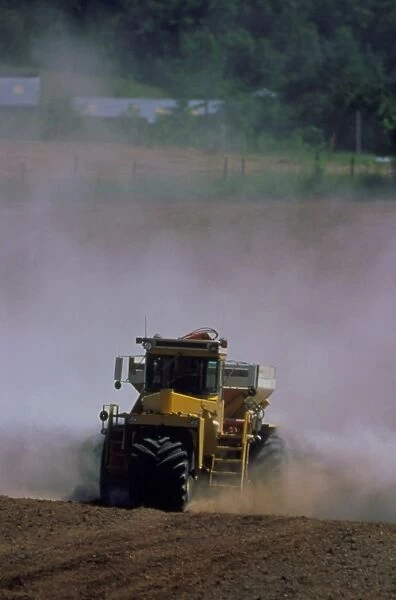 View of a tractor spreading lime