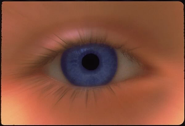 Zoom effect image of a young girls blue eye