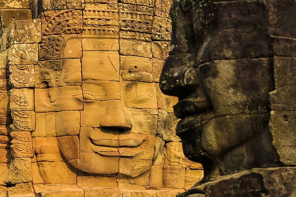Two of 216 smiling sandstone faces at 12th century Bayon, King Jayavarman VIIs last