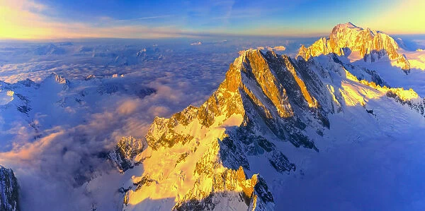 Aerial panoramic of Grandes Jorasses, Petites Jorasses and Mont Blanc at sunrise