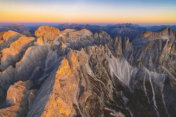 Aerial view of Torri Del Vajolet and Catinaccio Group lit by the autumn sunset, Dolomites