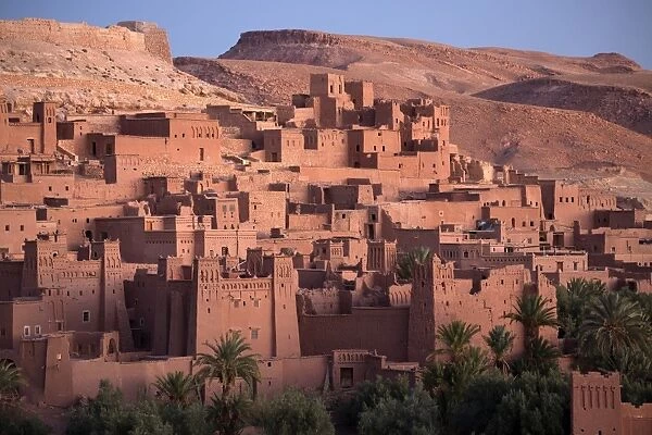 The ancient mud brick buildings of Kasbah Ait Benhaddou bathed in golden morning light