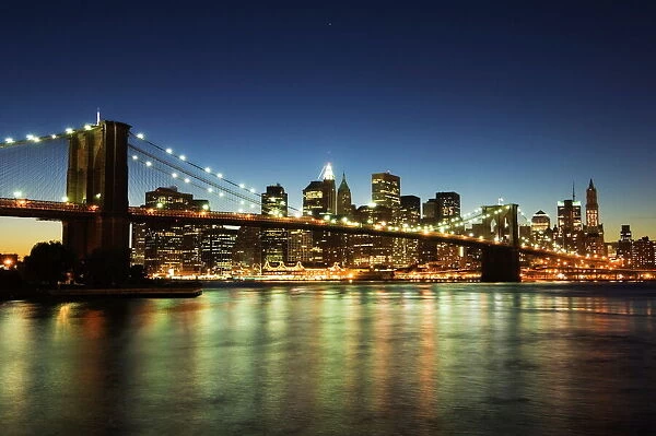 Brooklyn Bridge and Manhattan skyline at dusk
