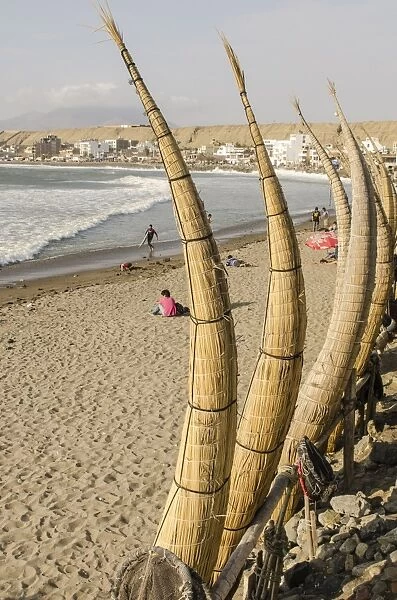 Caballitos de totora or reed boats on the beach in Huanchaco, Peru, South America