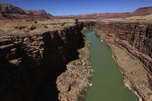 The Colorado River winds through the sheer cliffs of Marble Canyon, south of the Grand Canyon