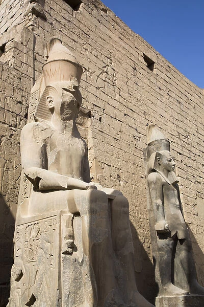 Colossi of Ramses II in front of Pylon, Luxor Temple, UNESCO World Heritage Site, Luxor