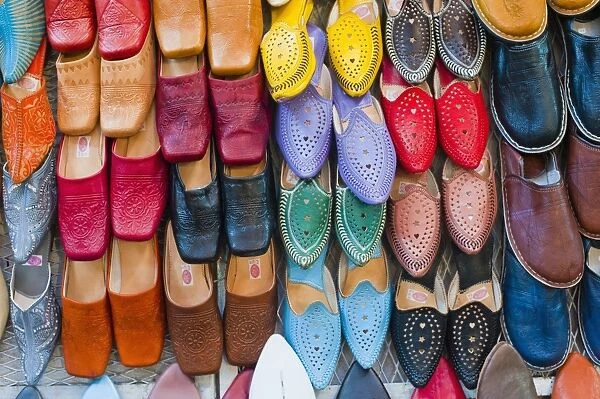 Colourful babouche (mens leather slippers) for sale in the Marrakech souks, Place Djemaa El Fna, Marrakech, Morocco, North Africa, Africa