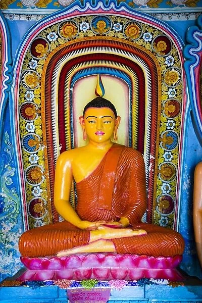 Colourful Buddha statue at Isurumuniya Vihara, Anuradhapura, UNESCO World Heritage Site, Sri Lanka, Asia