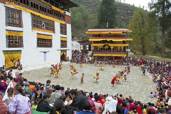 Crowds watching the dancers at the Paro festival, Paro, Bhutan, Asia