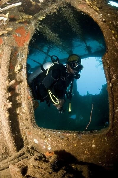 Diver inside the wreck of the Lesleen M freighter, sunk as an artificial reef in 1985 in Anse Cochon Bay, St. Lucia, West Indies, Caribbean, Central America