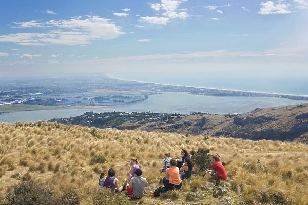 Group of young people enjoying a picnic on the Port Hills, Christchurch, Canterbury