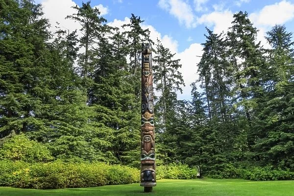 K alyaan Pole, Tlingit totem pole, rainforest clearing, summer, Sitka National Historic Park