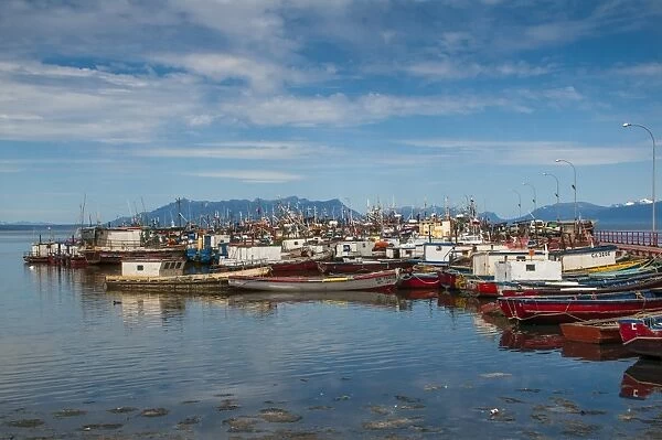 Many little boats in the harbour of Puerto Natales, Patagonia, Chile, South America