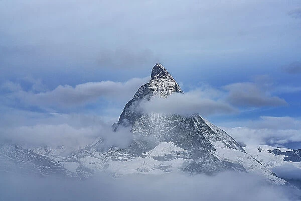 Majestic Matterhorn in autumn mist during the blue hour, Gornergrat, Zermatt, canton of Valais, Switzerland, Europe