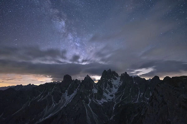 Milky Way and stars over the sharp pinnacles of Cadini di Misurina, Dolomites