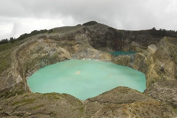 Multi-coloured crater lakes at summit of Kelimutu volcano, eastern Flores, Nusa Tenggara, Indonesia, Southeast Asia, Asia