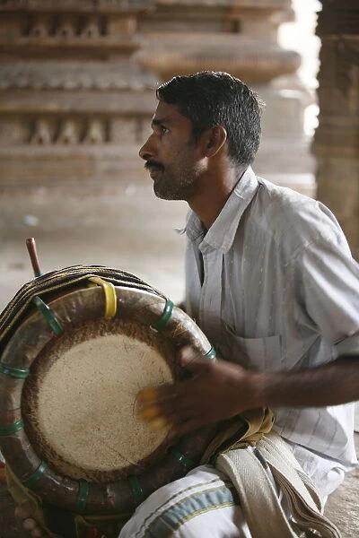 Musician calling for the puja, Trivalenjury temple, Tamil Nadu, India, Asia