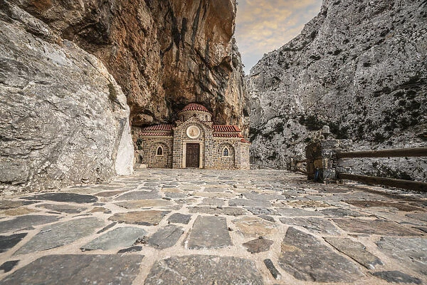 Orthodox chapel Agios Nikolaos nestled in rocks in Kotsifou canyon, Crete island