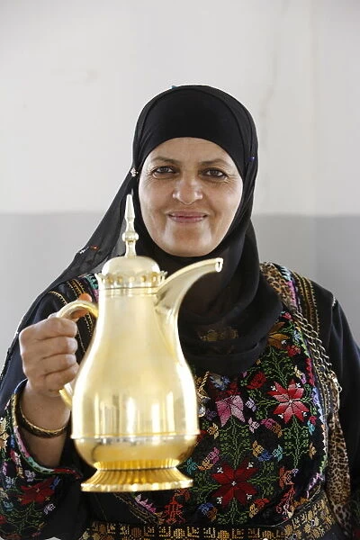 Palestinian volunteer offering coffee at the Physicians for Human Rights