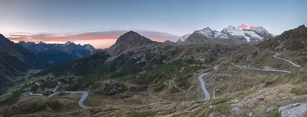 Panoramic of the road bends of Bernina Pass at dawn, Poschiavo Valley, Engadine