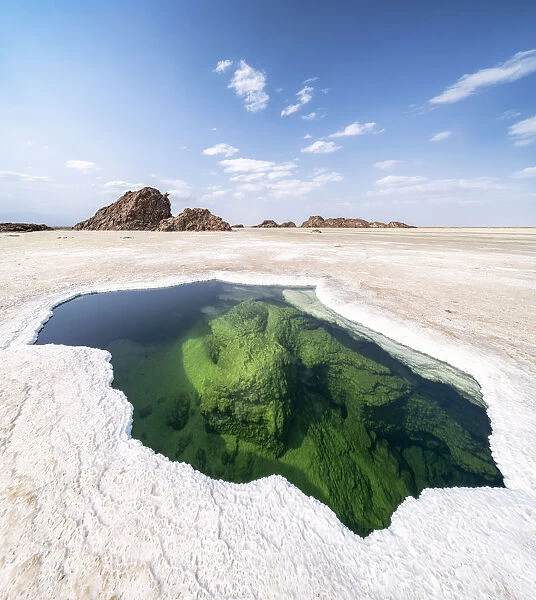Panoramic of the transparent water of natural pond in the salt pan, Danakil Depression