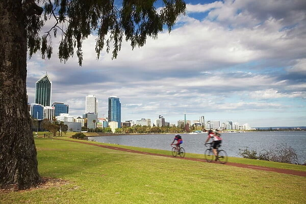 People cycling alongside Swan River, Perth, Western Australia, Australia, Pacific