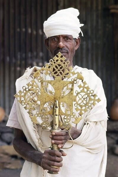 Portrait of a man holding a treasure from the Narga Selassie Christian church