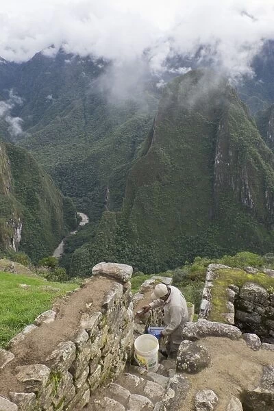 Restoration work at the Inca ruins of Machu Picchu, UNESCO World Heritage Site, Peru