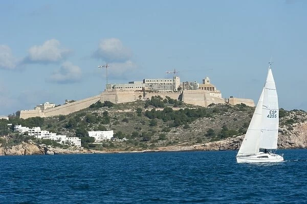 Sailboat participating in Regatta, view of Ibiza Old Town and Dalt Vila, UNESCO World Heritage Site, Ibiza, Balearic Islands, Spain, Mediterranean, Europe