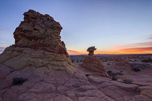 Sandstone formation at dawn with orange clouds, Coyote Buttes Wilderness, Vermilion Cliffs National Monument, Arizona, United States of America, North America