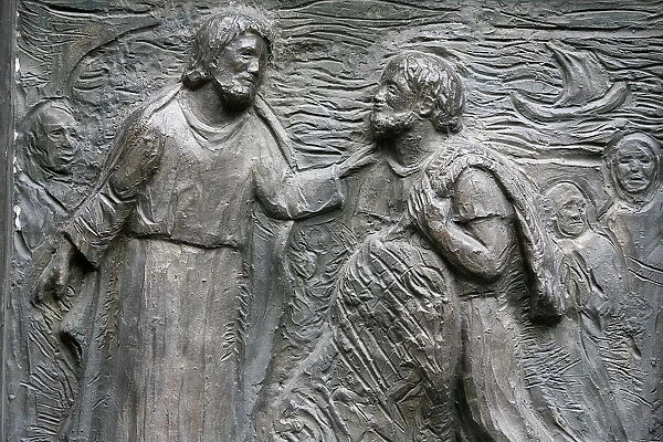 Sculpture of the calling of St. Peter on the Notre Dame door
