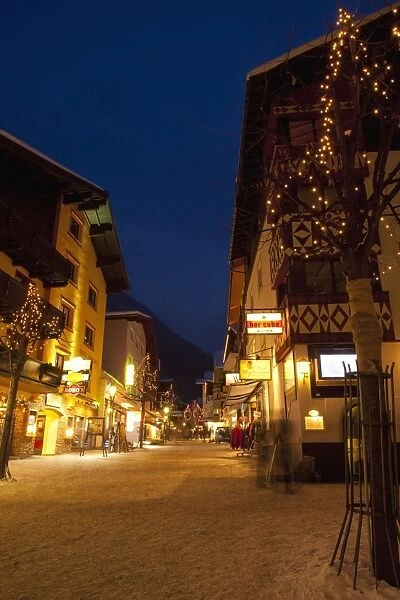St. Anton am Arlberg high street in winter snow in the evening, Tyrol, Austrian Alps