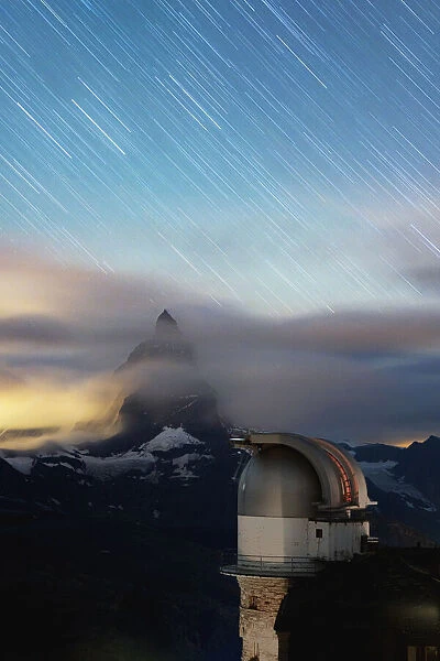 Star trail in the night sky on Matterhorn from observatory tower of Kulmhotel Gornergrat